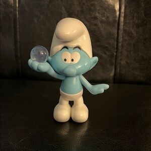 Blue Smurf Figure Holding Clear Orb